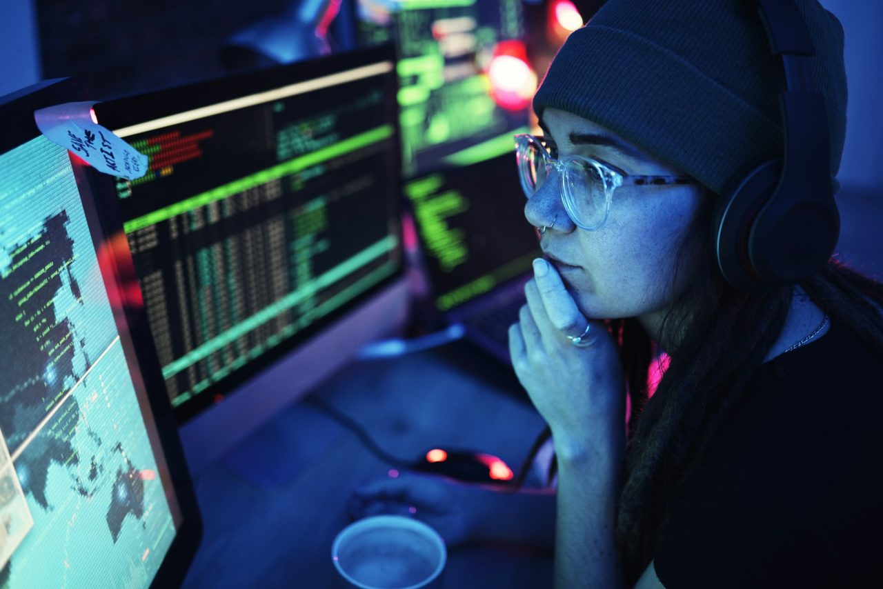 Site DT 4 woman computer and hacker with music headphones and programming for cybersecurity thinking radio